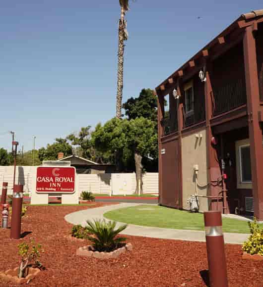 Casa Royal Inn San Jose exterior with welcoming signage for events and gatherings.