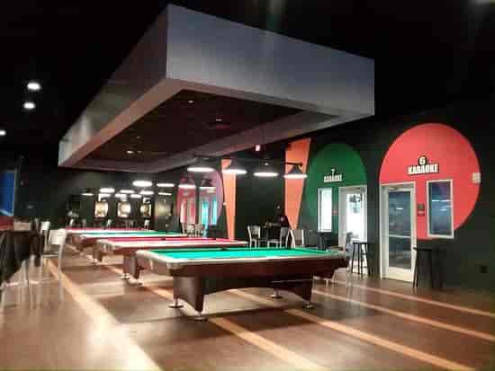 Karaoke room at Round1 USA with vibrant decor, perfect for events and team-building.