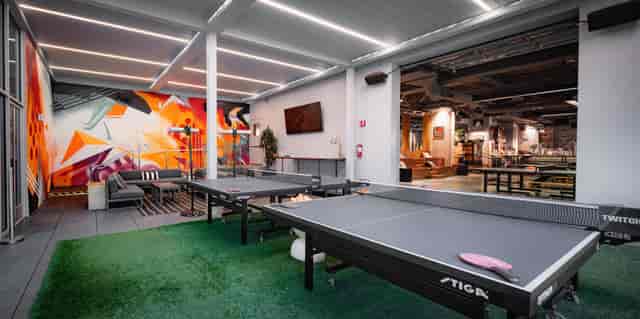 Modern event space with ping pong tables for casual meetings in San Francisco.