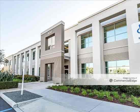 Modern meeting room with large windows, ideal for corporate events and workshops.