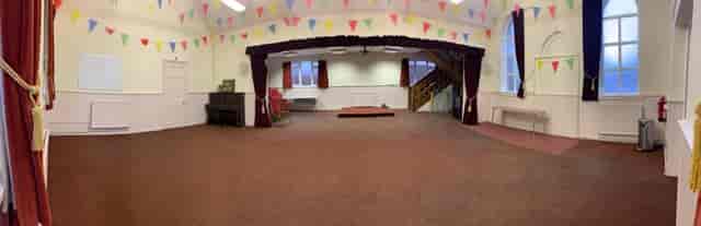 Banquet hall in Foulsham Hall with colorful bunting for events and gatherings.