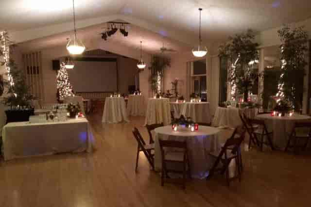 Beautiful garden event space with elegant tables, ideal for weddings and receptions.
