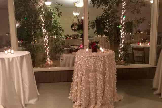 Elegant garden event space with soft lighting, perfect for weddings and receptions.