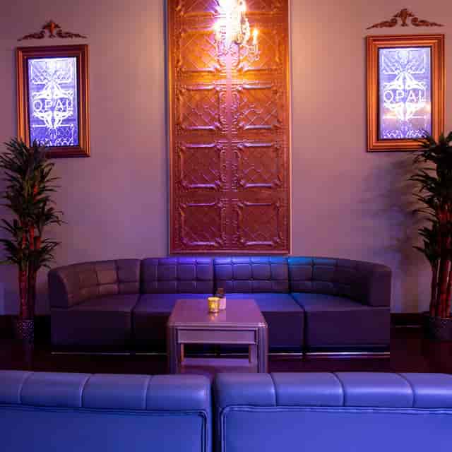 Outdoor group space at OPAL Social Club with modern seating for networking events.