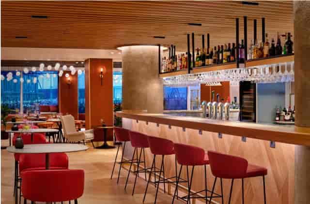 Modern bar area at Sheraton Amsterdam, perfect for networking events and gatherings.