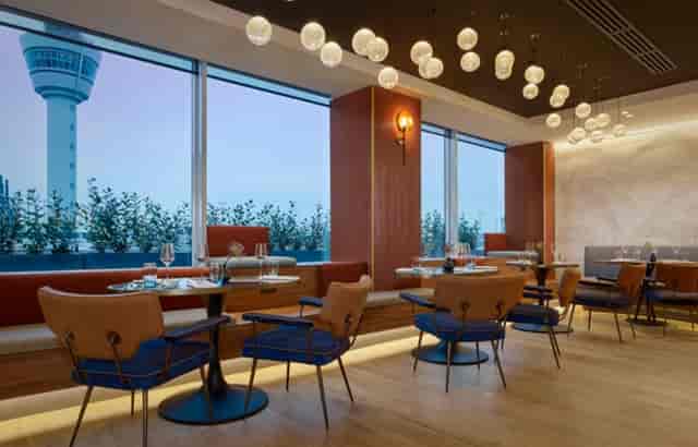 Modern dining space at Sheraton Amsterdam, ideal for corporate dinners and events.