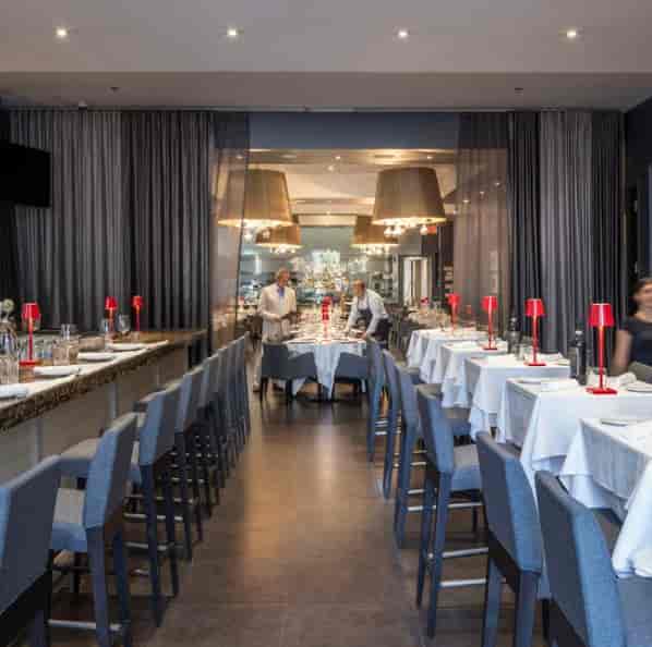 Private dining room in Modus with elegant table settings for corporate events.