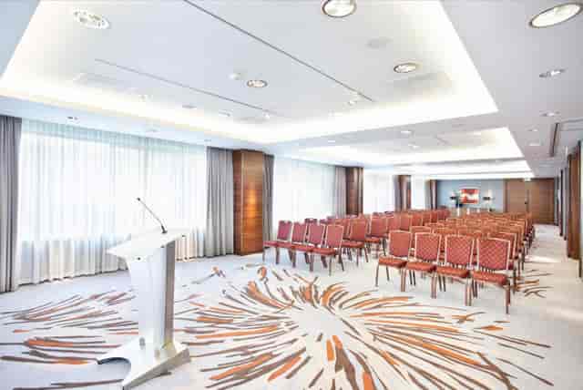 Modern meeting room at Hotel Okura, ideal for conferences and workshops.
