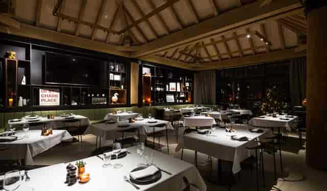 Sophisticated dining space with elegant table settings for corporate events and private dinners.