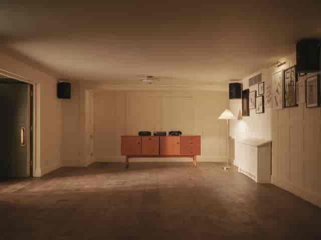 Versatile event space with warm lighting and wooden accents at High Road House.