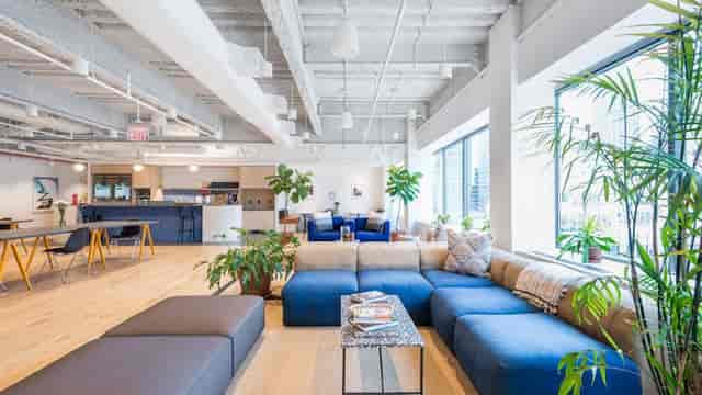 Modern conference room with natural light, ideal for networking events and meetings.