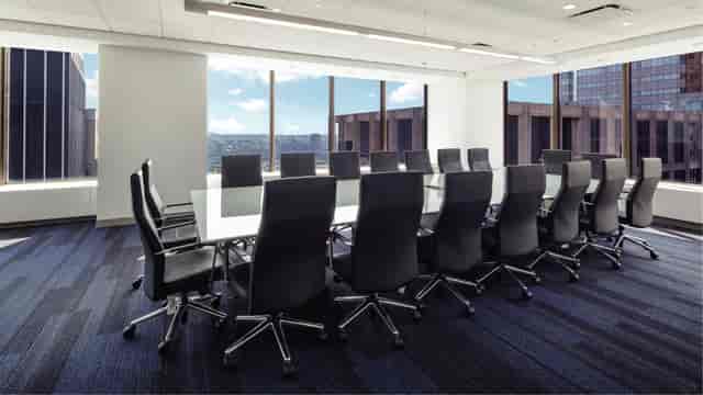 Modern conference room with glass table, ideal for meetings and presentations in Financial District.
