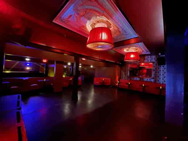 Stylish Roof Deck at Continental Club with red lighting, ideal for events and parties.