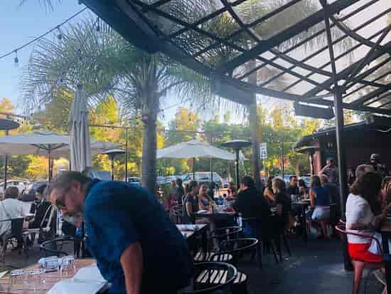 Outdoor Tequila Bar at Milagros: vibrant event space with seating for social gatherings.