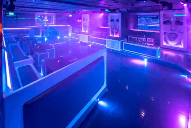 Modern event space in Q-Shoreditch with sleek seating, ideal for nightlife and parties.
