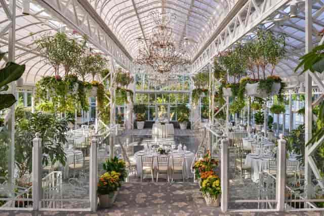 Elegant greenhouse venue at The Madison Hotel for weddings and corporate events.