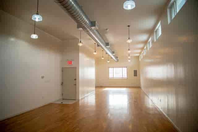 Versatile Greenpoint Hall event space with natural light, ideal for meetings and workshops.