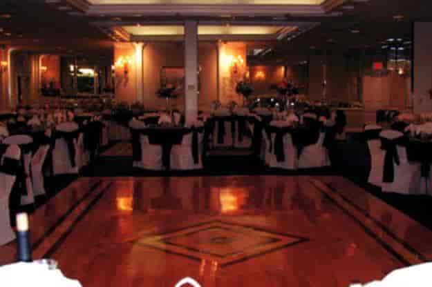 Elegant ballroom with black and white linens for golf outings and formal events.