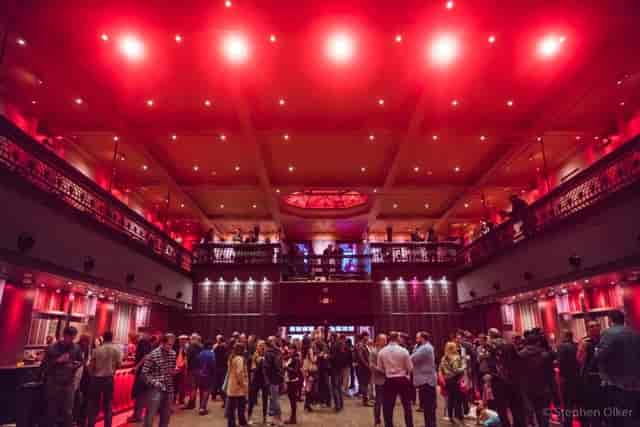 White Eagle Hall event space with red lighting, ideal for receptions and gatherings.