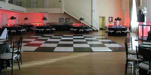 Historic Grand Ballroom with black and white dance floor, perfect for weddings and corporate events.