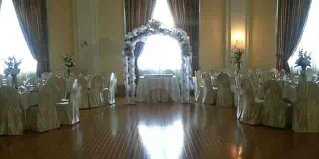 Historic Grand Ballroom with floral arch, ideal for weddings and receptions.