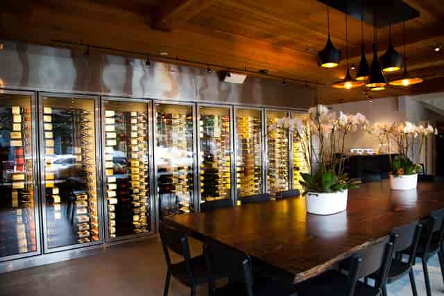 Sophisticated dining space with wine display, perfect for upscale events and wine tastings.