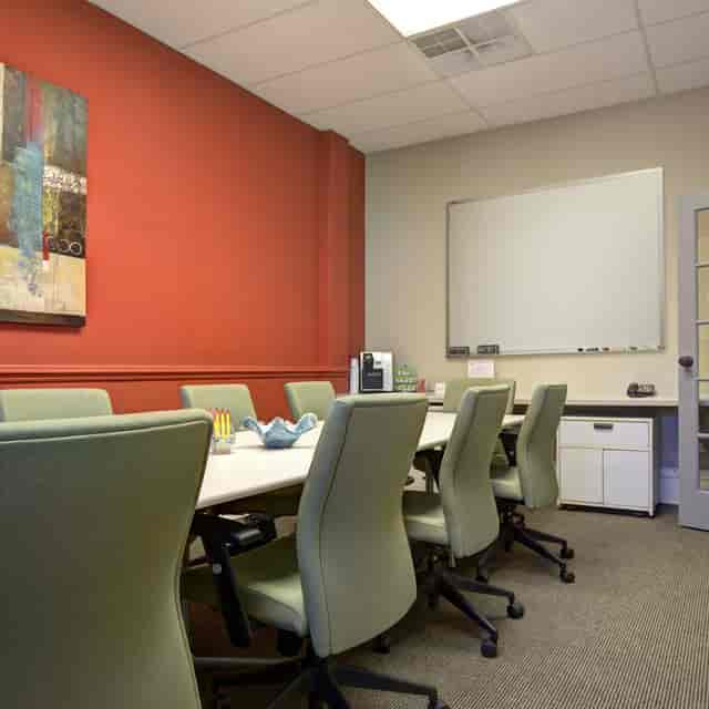 Meeting room with spacious table and chairs for productive business meetings and events.