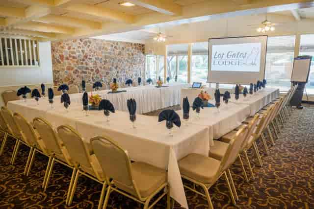 Saratoga Room meeting space with U-shaped table setup for professional events.