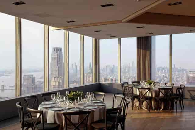 Elegant event space at The Shed, featuring panoramic city views for upscale gatherings.