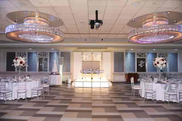Elegant event space at Russo's On The Bay with chandeliers for upscale gatherings.