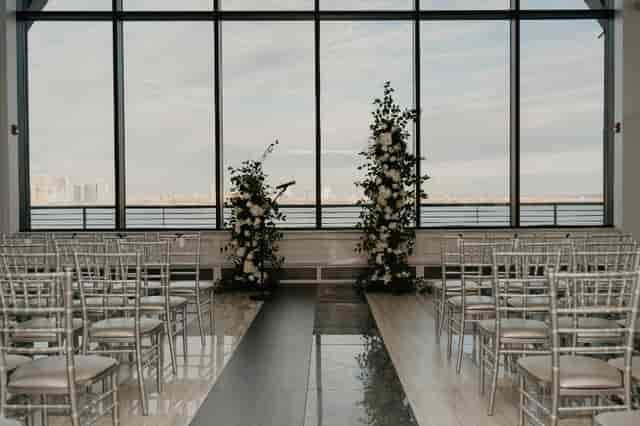 Elegant dance floor at Hudson House with waterfront view, ideal for weddings and events.