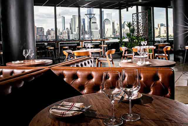 Indoor dining area at Lokal Eatery & Bar with leather seating, ideal for corporate events.
