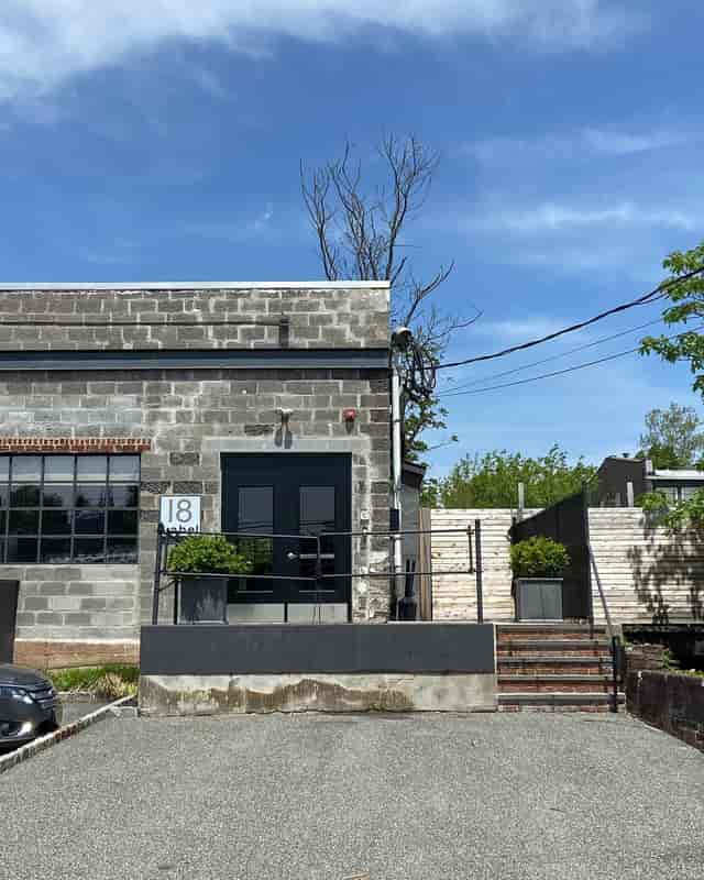 Modern industrial venue with exposed brick, perfect for intimate gatherings and creative events.