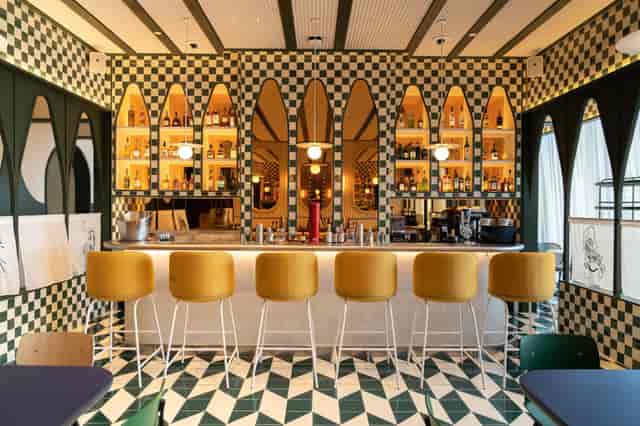 Stylish bar with vibrant decor at The Biergarten for events and gatherings.