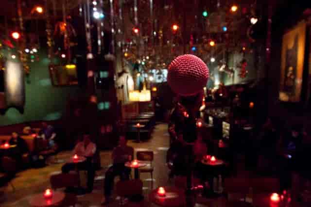 Cozy Make Out Room venue with microphone, perfect for open mics and small concerts.