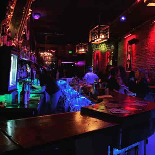 VIP booths at Cat Club with colorful lighting for networking events and social gatherings.