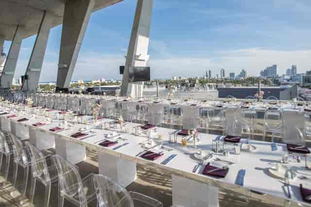 Rooftop event space at 1111 Lincoln Road, elegant dinner setup with city view.
