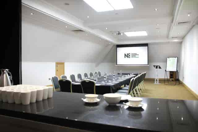 Meeting room at The Crows Nest, featuring a large table for professional events and workshops.