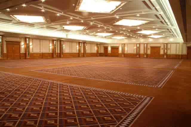 Elegant Britannia Suite with high ceilings, perfect for corporate events and weddings.