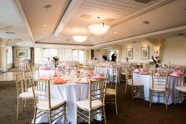 Elegant private conference room with floral centerpieces, perfect for weddings and events.