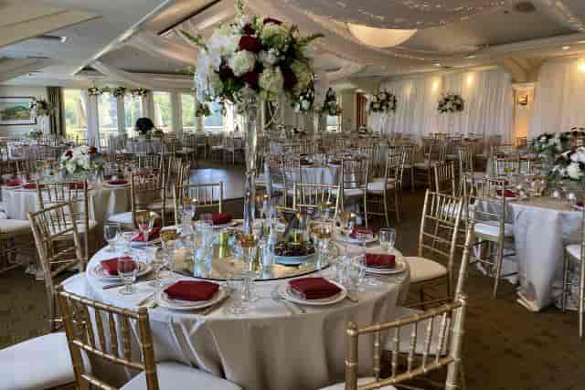 Elegant private conference room with gold chiavari chairs for weddings and formal events.