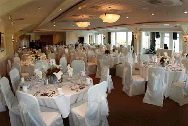 Elegant Wedding Pavilion banquet hall with round tables, ideal for weddings and events.