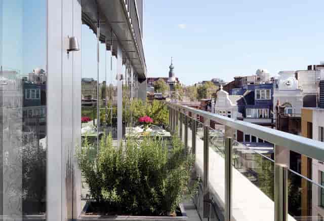 Rooftop terrace at Ham Yard Hotel with city skyline view, perfect for outdoor events.
