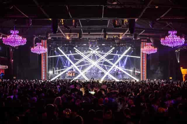 Vibrant Fillmore Auditorium balcony with chandeliers, perfect for concerts and events.