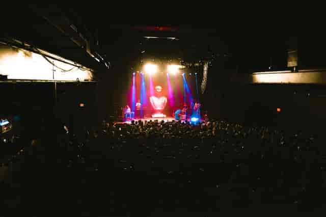 Vibrant live event at The Factory in Deep Ellum with dynamic lighting and heart backdrop.