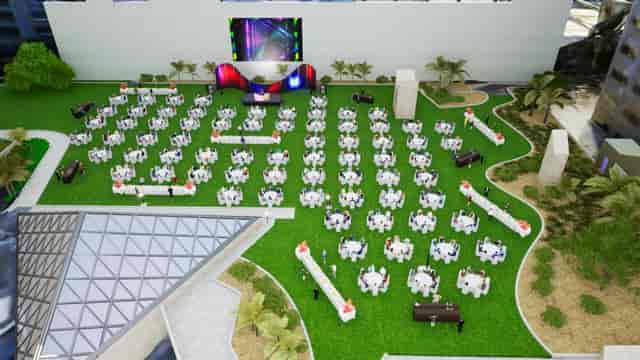 Outdoor event setup at Skylawn, InterContinental Miami, featuring round tables and stage.