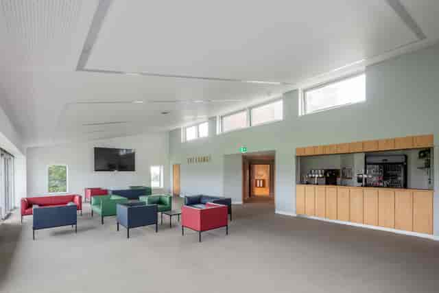 UCS New Pavilion Eve Lounge: modern meeting space with natural light for networking events.