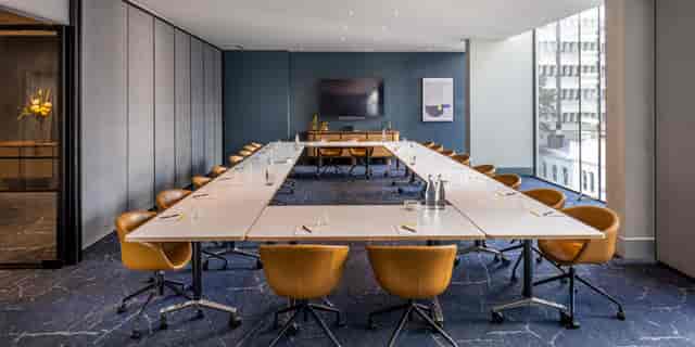 Modern meeting room with U-shaped table, ideal for corporate events in Seoul.
