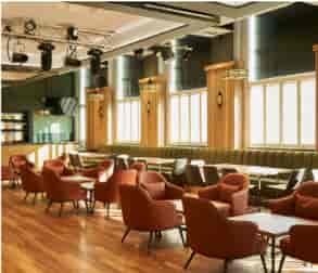 Stylish event space at Freddie's Bar with modern decor, ideal for networking and meetings.