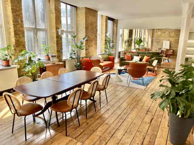 Bright meeting space in The Artist's Loft, ideal for collaborative sessions and gatherings.